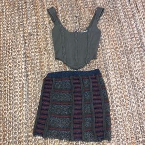 Danielle Guizo green corset and mini skirt